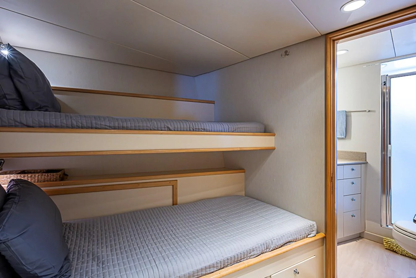 The guest cabin features cozy bunk beds and an en-suite bathroom for comfort and convenience. aboard PROBABILITY Yacht for Sale