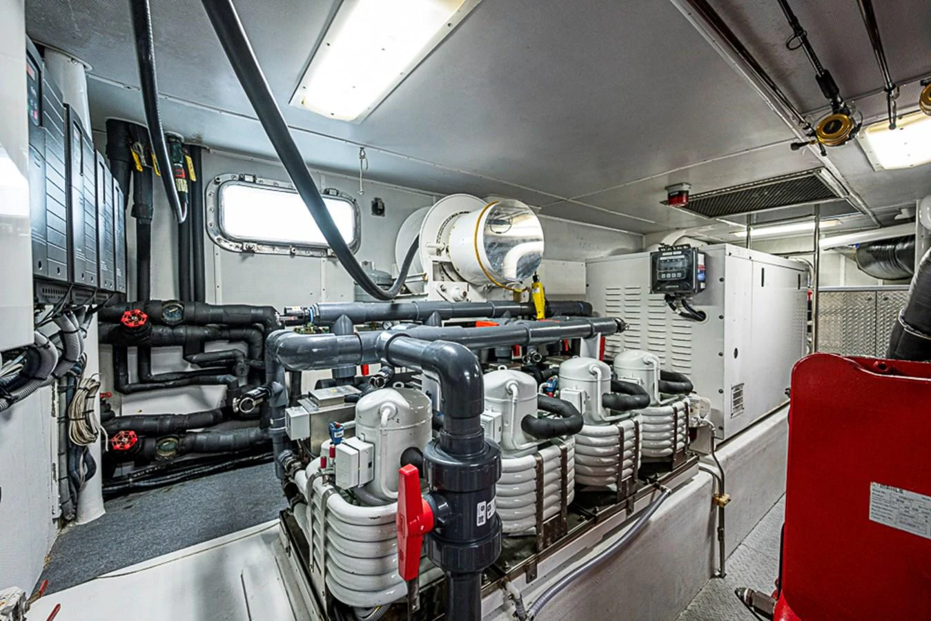 The image showcases the yacht's well-maintained engine room with advanced machinery and equipment. aboard PROBABILITY Yacht for Sale