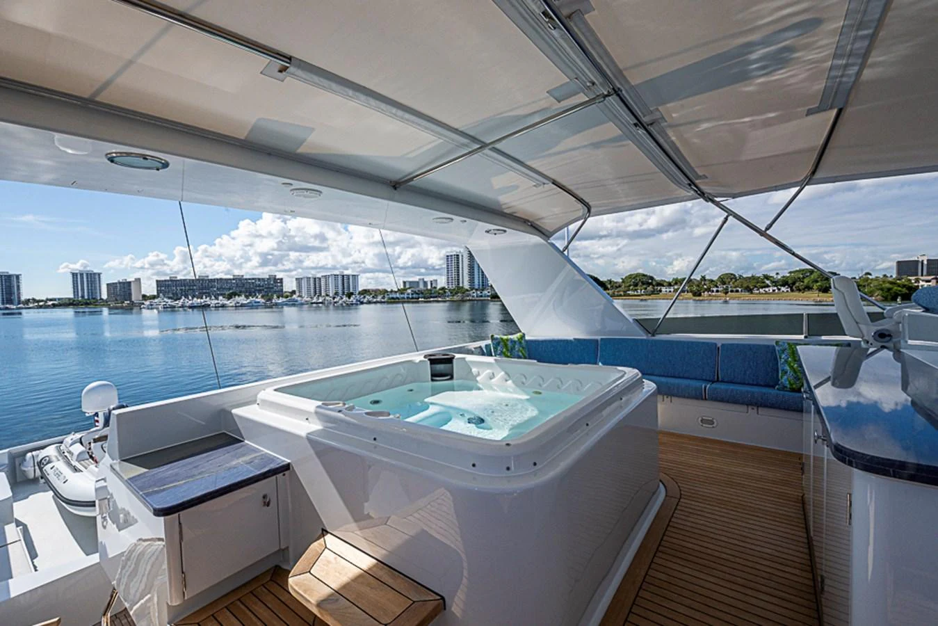 The sundeck features a luxurious hot tub with a stunning view of the marina. aboard PROBABILITY Yacht for Sale