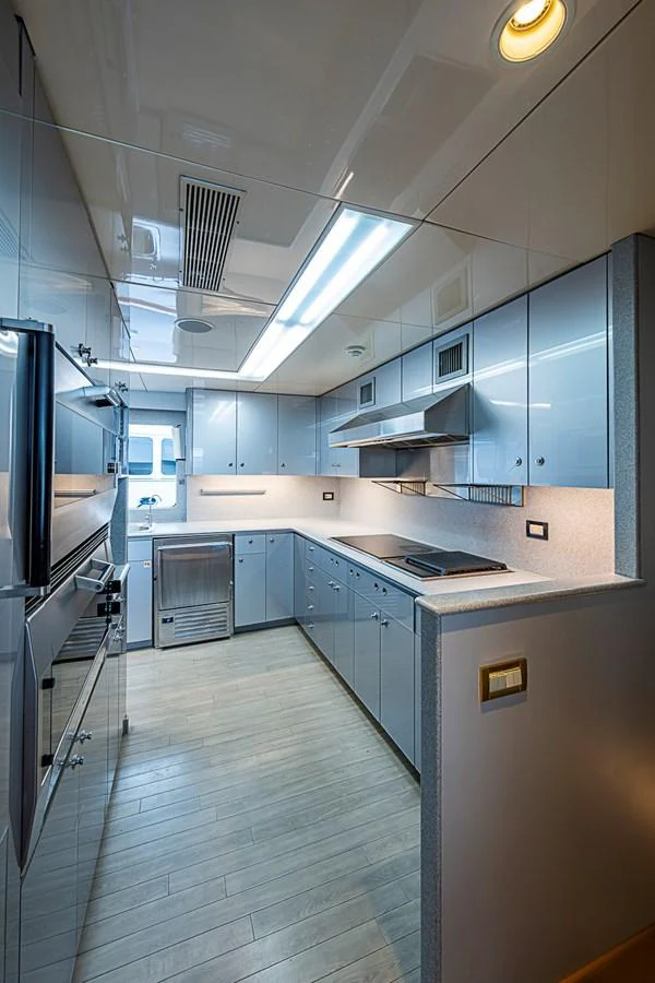 The yacht's galley is sleek and modern, featuring high-end appliances and ample counter space. aboard PROBABILITY Yacht for Sale