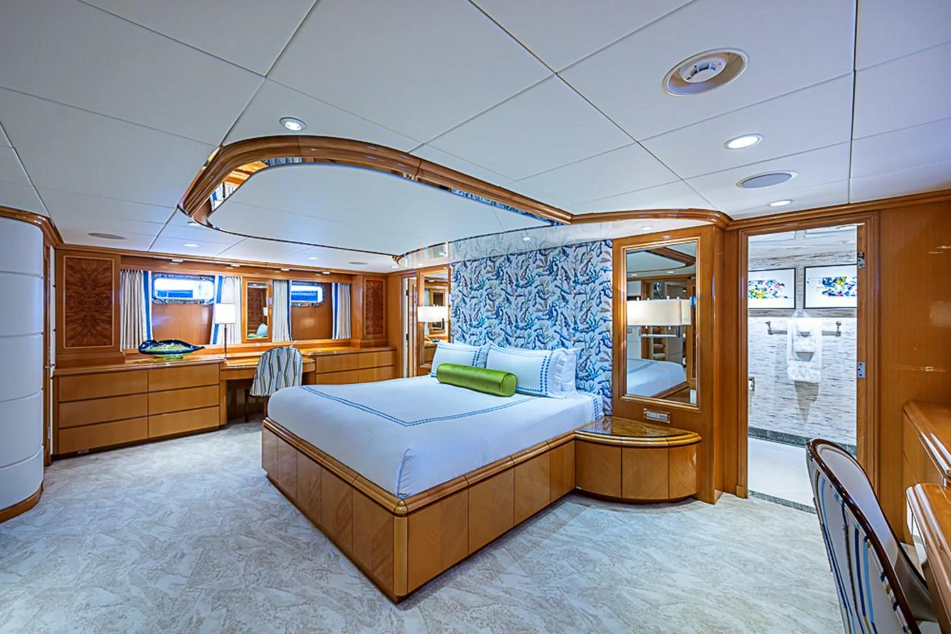 The master stateroom features a spacious bed, elegant woodwork, and luxurious decor. aboard PROBABILITY Yacht for Sale