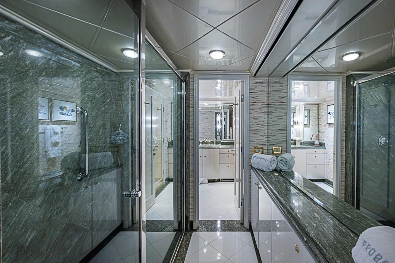 The yacht's bathroom features luxurious marble finishes and modern fixtures. aboard PROBABILITY Yacht for Sale