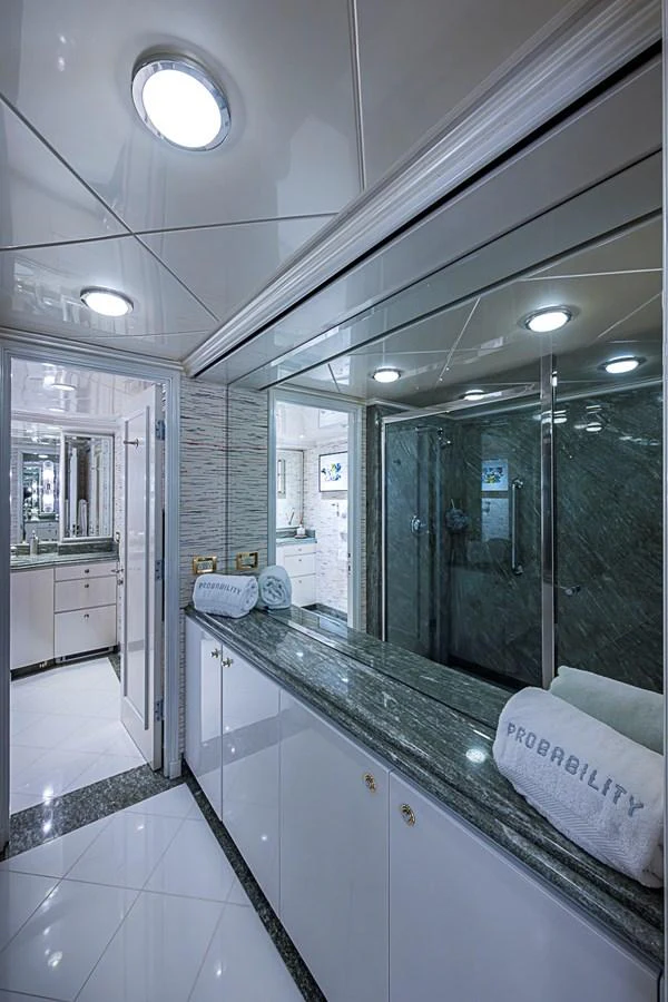 A luxurious yacht bathroom with sleek countertops and modern fixtures. aboard PROBABILITY Yacht for Sale