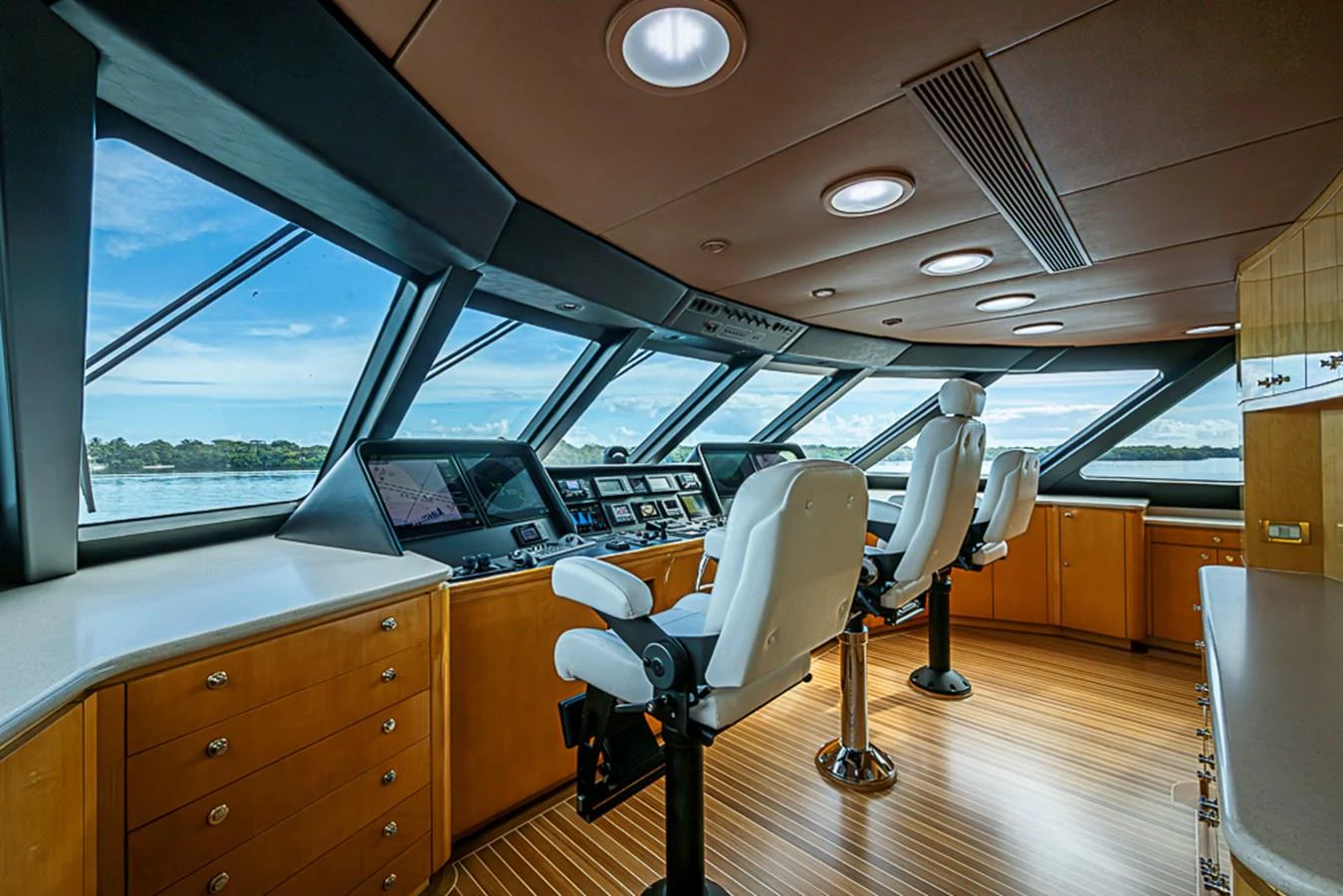 The helm station features state-of-the-art navigation equipment and luxurious seating with panoramic views. aboard PROBABILITY Yacht for Sale
