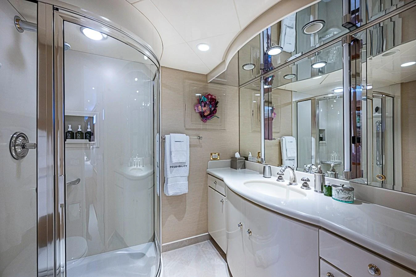 The yacht's bathroom features a sleek design with a spacious shower and elegant fixtures. aboard PROBABILITY Yacht for Sale