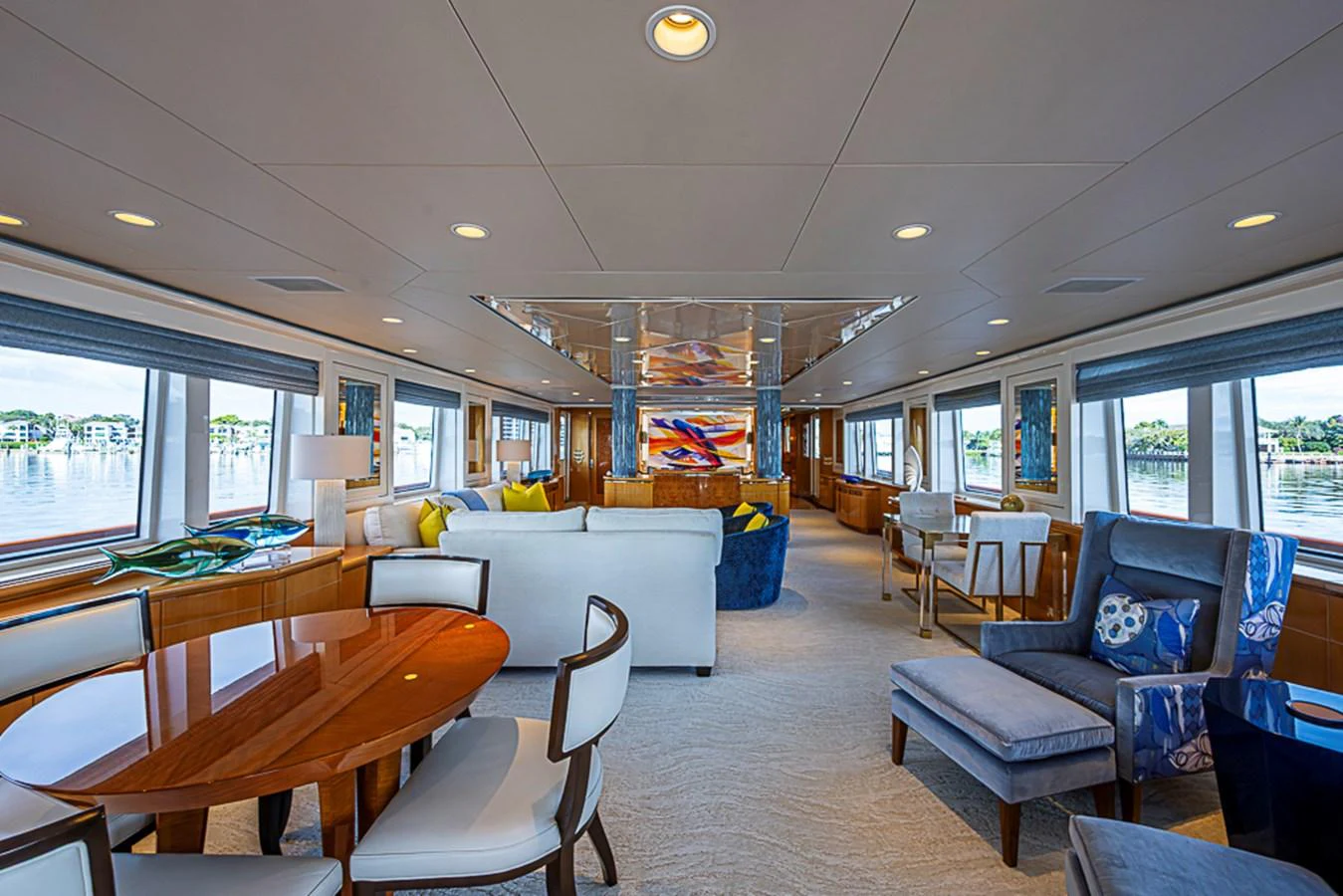 The spacious salon features elegant seating and panoramic windows, creating a luxurious and inviting atmosphere. aboard PROBABILITY Yacht for Sale
