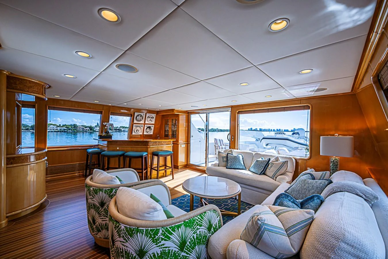 The salon features a spacious and elegantly designed seating area with large windows offering stunning views. aboard PROBABILITY Yacht for Sale