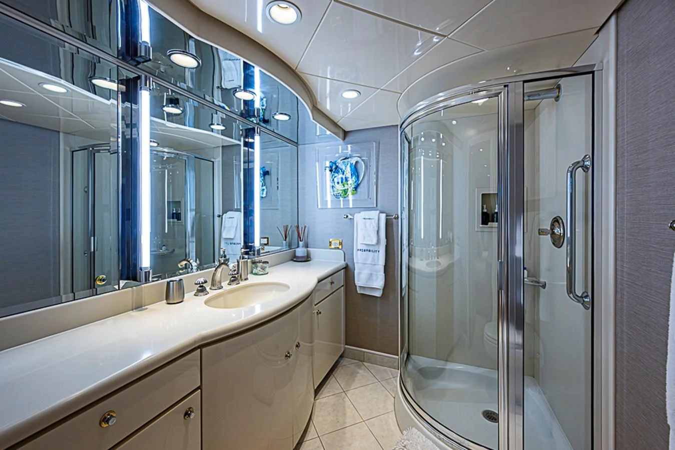 The yacht's bathroom features modern fixtures and a spacious shower. aboard PROBABILITY Yacht for Sale