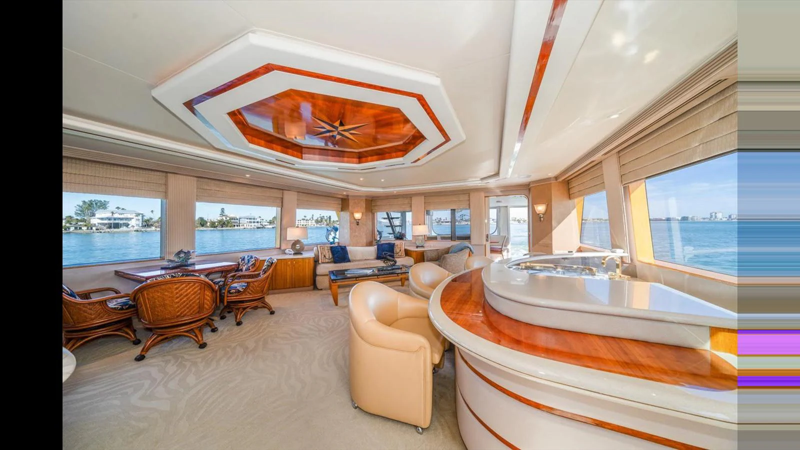The salon offers a spacious and elegant area with ample seating and panoramic views. aboard THINK B.I.G Yacht for Sale