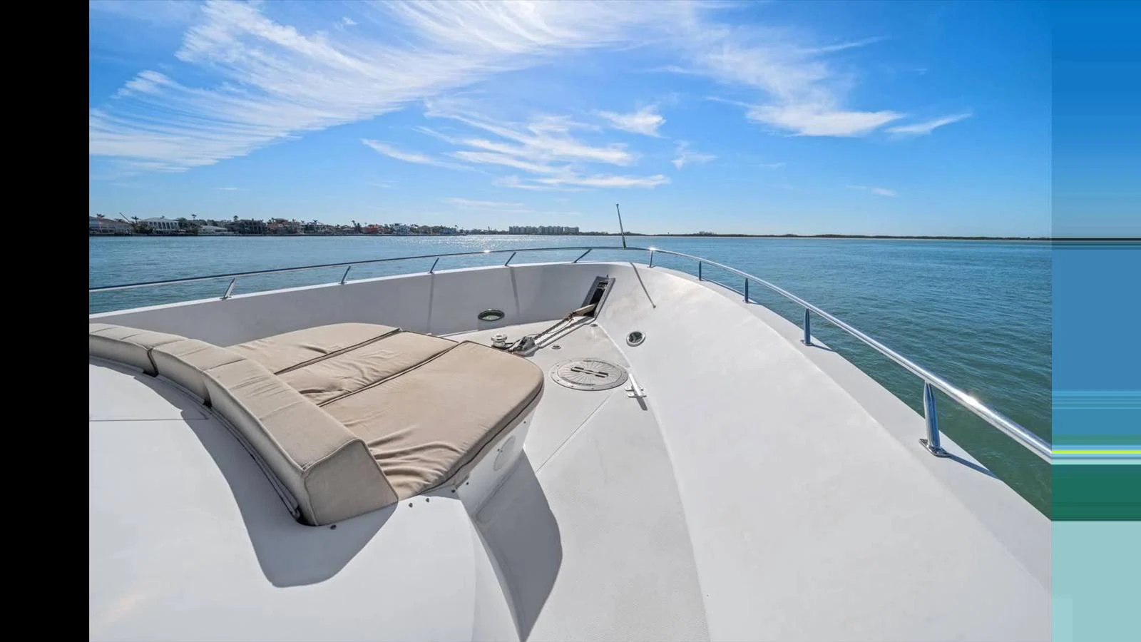 The foredeck features a spacious sunbathing area with stunning views of the water. aboard THINK B.I.G Yacht for Sale