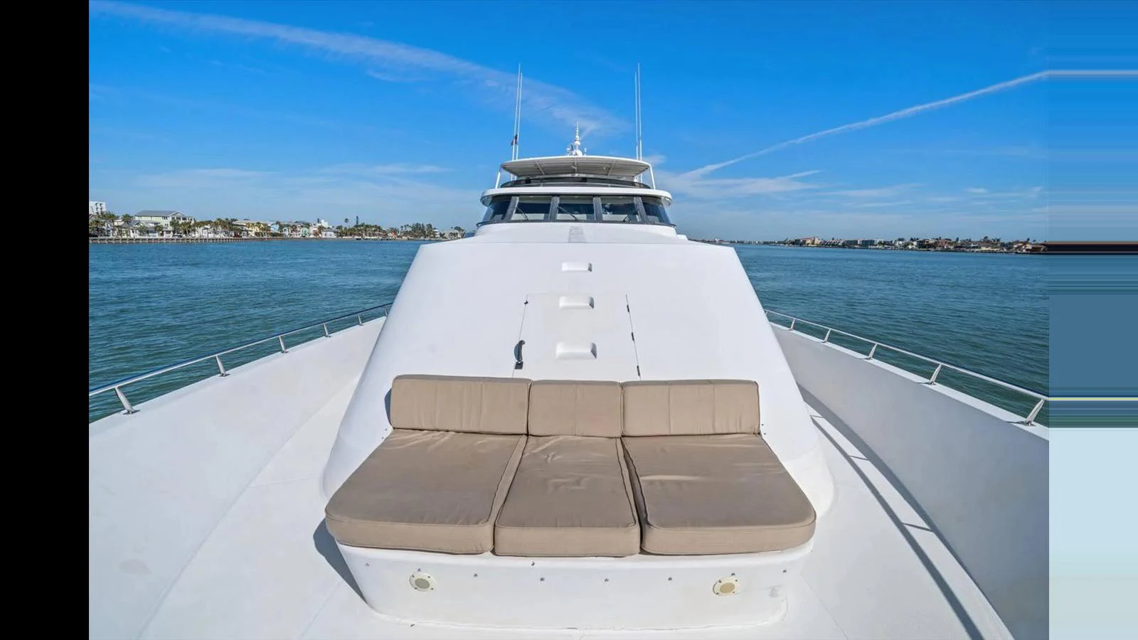 The foredeck features a spacious sunbathing area with comfortable cushions, perfect for relaxation. aboard THINK B.I.G Yacht for Sale