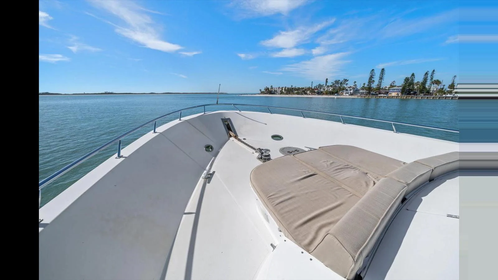 The foredeck features a spacious sunpad area with stunning views of the surrounding waters. aboard THINK B.I.G Yacht for Sale