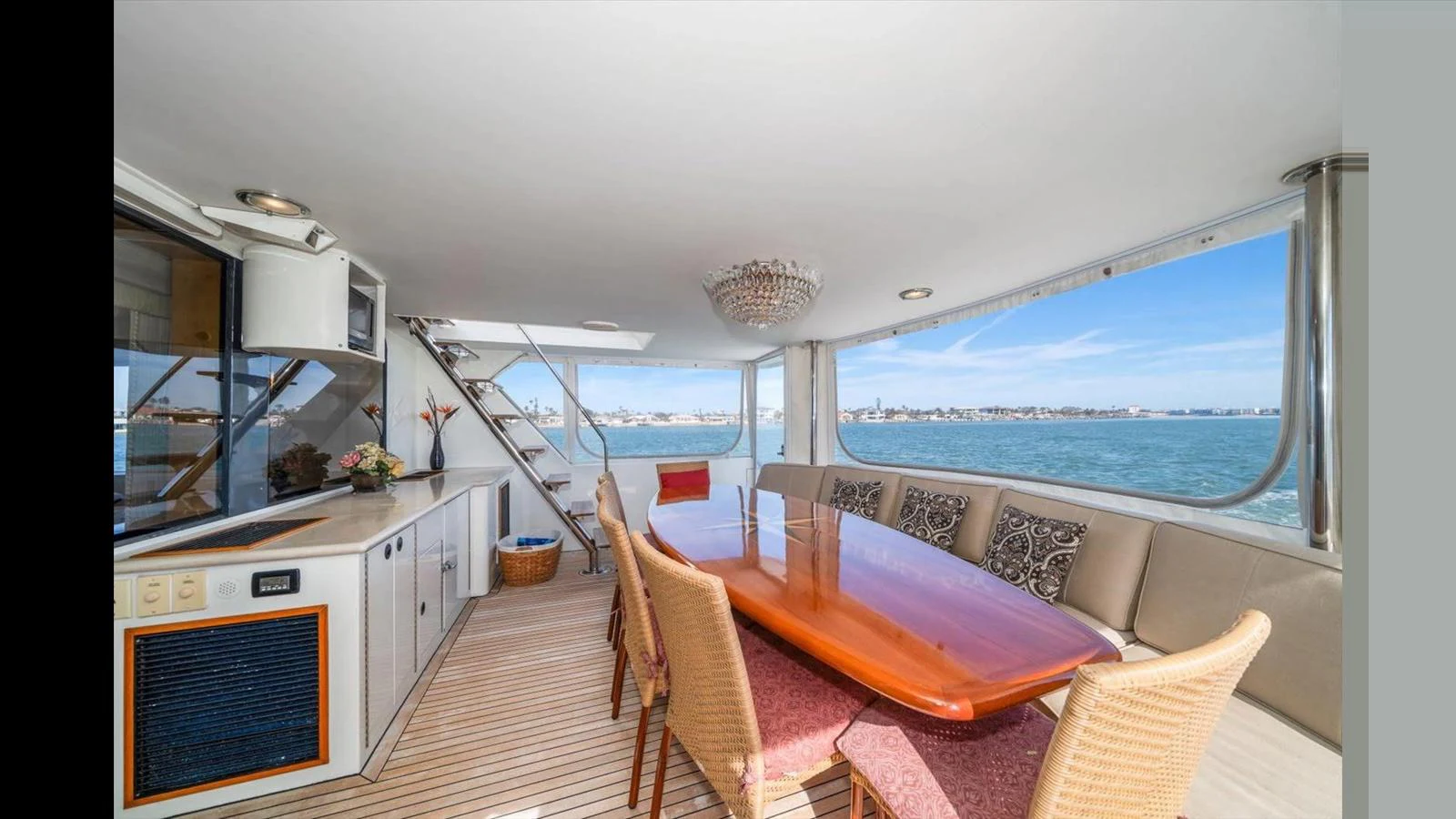 This yacht's dining area offers a spacious and elegant setting with panoramic views of the sea. aboard THINK B.I.G Yacht for Sale