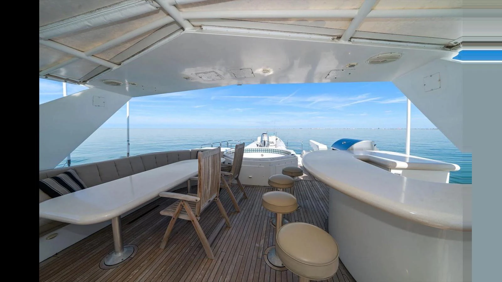 The flybridge offers a spacious and inviting area with ample seating and a bar, perfect for enjoying the sea views. aboard THINK B.I.G Yacht for Sale