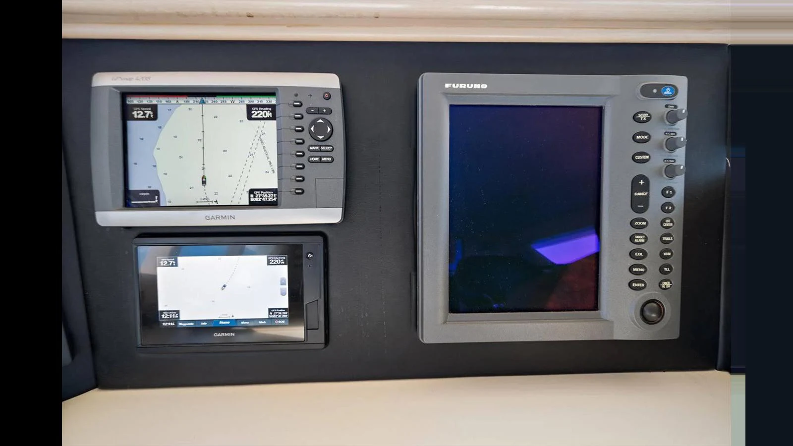 The image showcases the navigation and control instruments at the yacht's helm. aboard THINK B.I.G Yacht for Sale