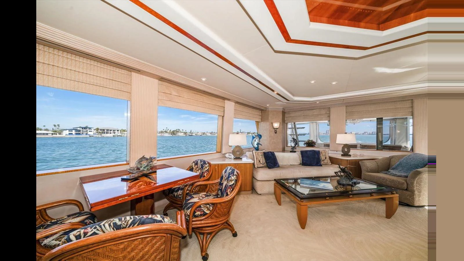 The yacht's salon offers a luxurious and spacious seating area with large windows providing stunning ocean views. aboard THINK B.I.G Yacht for Sale
