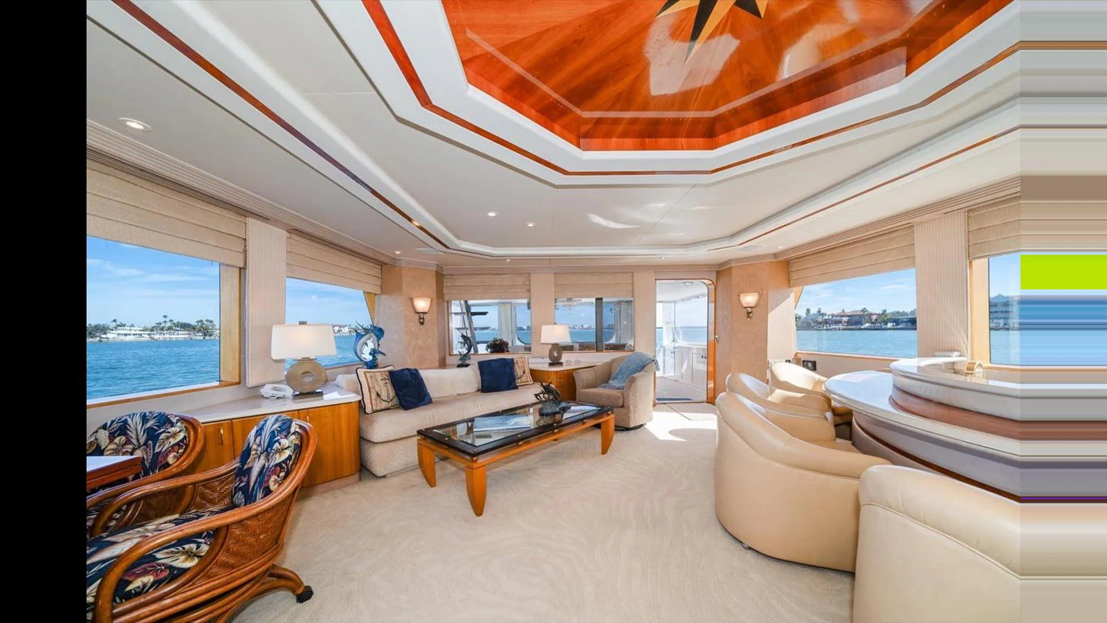 The salon offers a spacious and elegant area with comfortable seating and panoramic windows. aboard THINK B.I.G Yacht for Sale