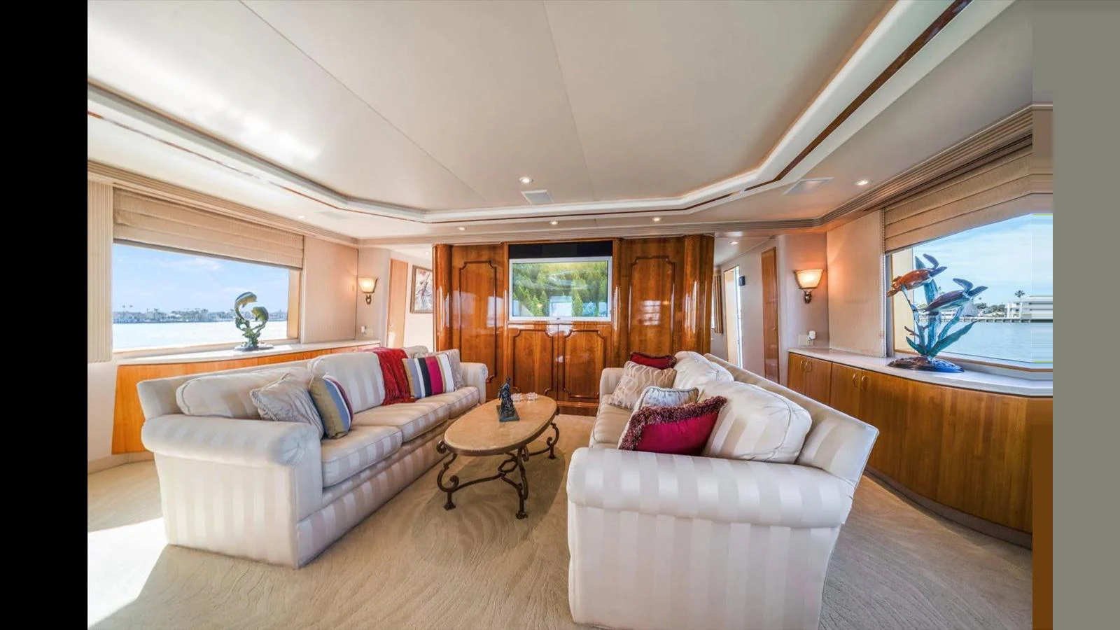 The yacht's salon features plush seating and large windows offering panoramic views. aboard THINK B.I.G Yacht for Sale