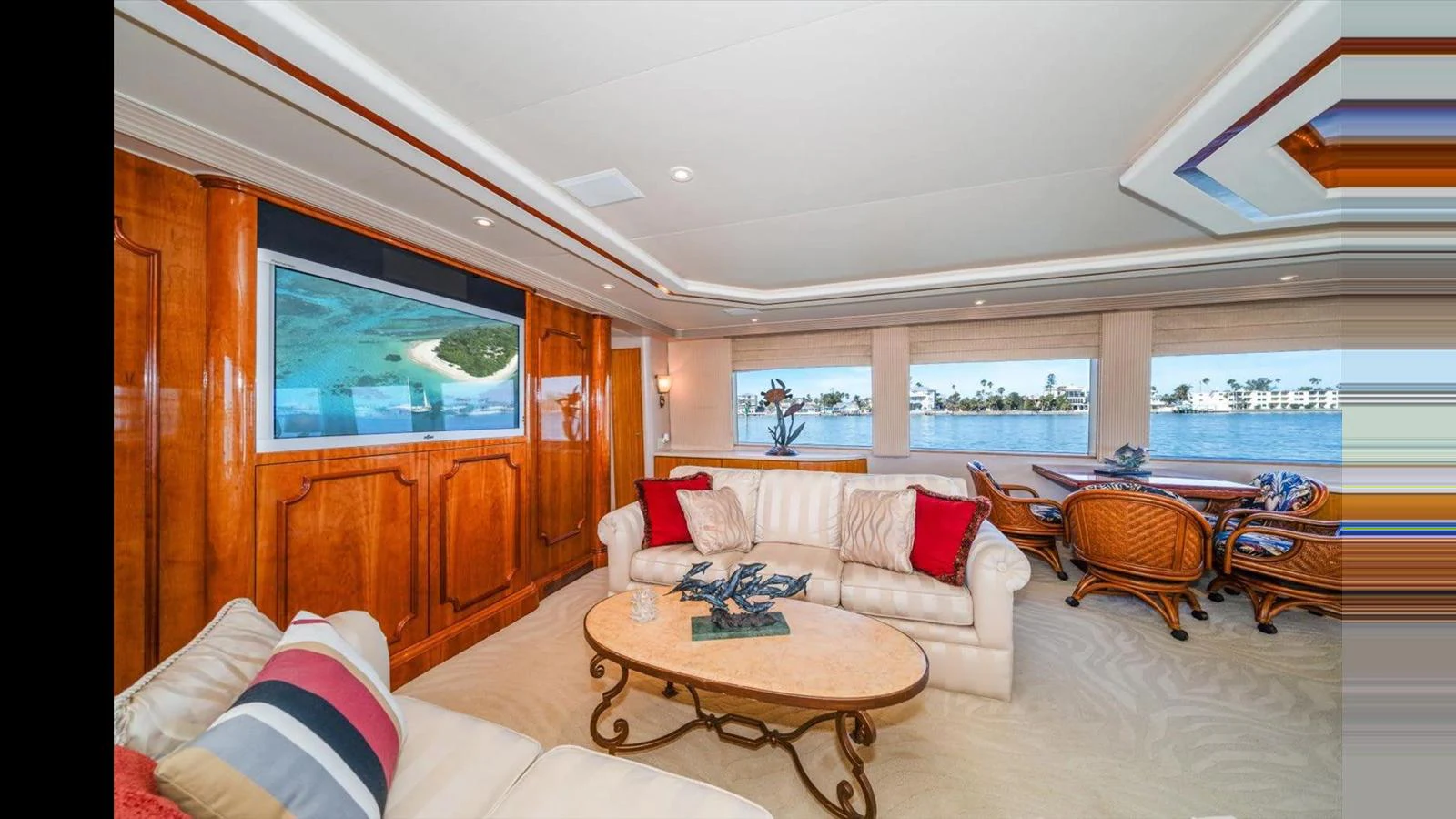 The salon features plush seating, elegant woodwork, and large windows offering stunning views. aboard THINK B.I.G Yacht for Sale