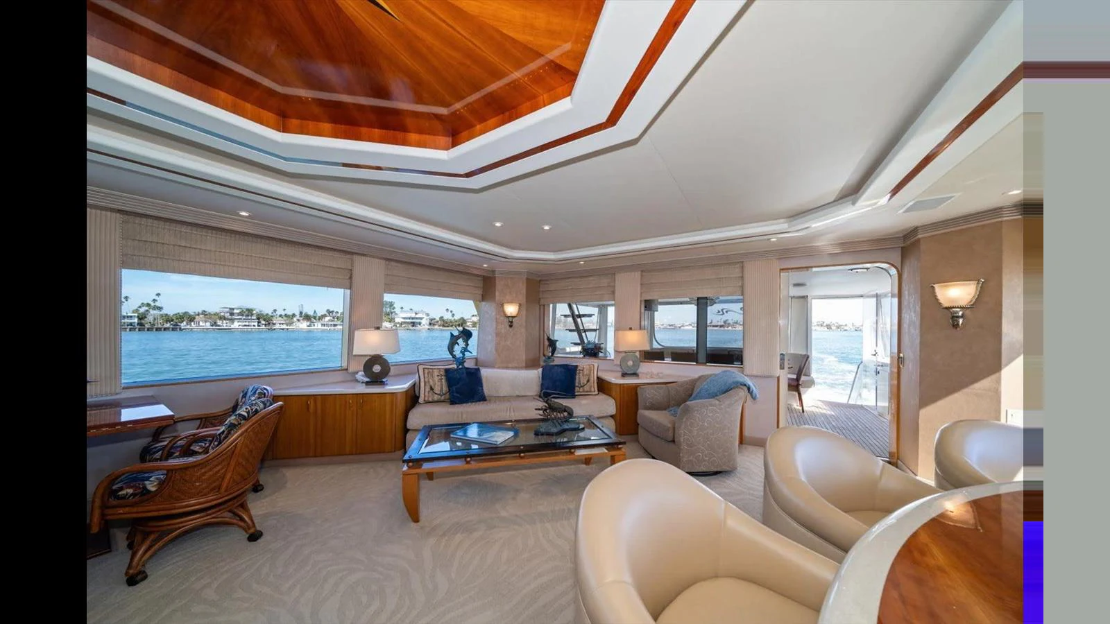 The salon offers a spacious and elegant area with ample seating and large windows providing stunning views. aboard THINK B.I.G Yacht for Sale