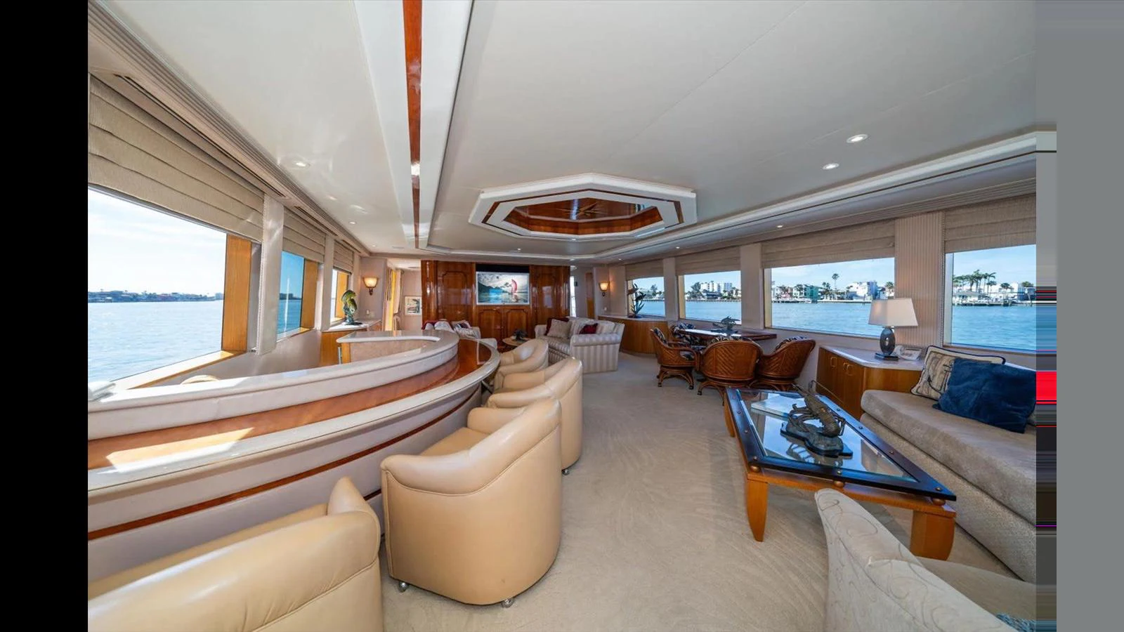 The spacious salon offers luxurious seating with panoramic views through large windows. aboard THINK B.I.G Yacht for Sale