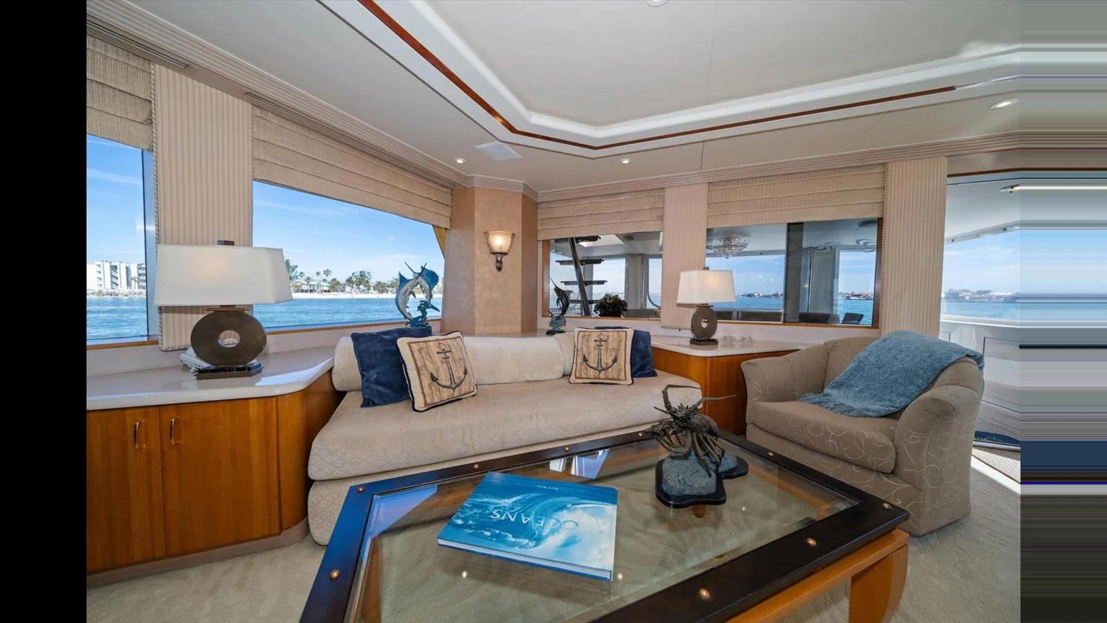 The salon offers a comfortable seating area with large windows providing panoramic views. aboard THINK B.I.G Yacht for Sale