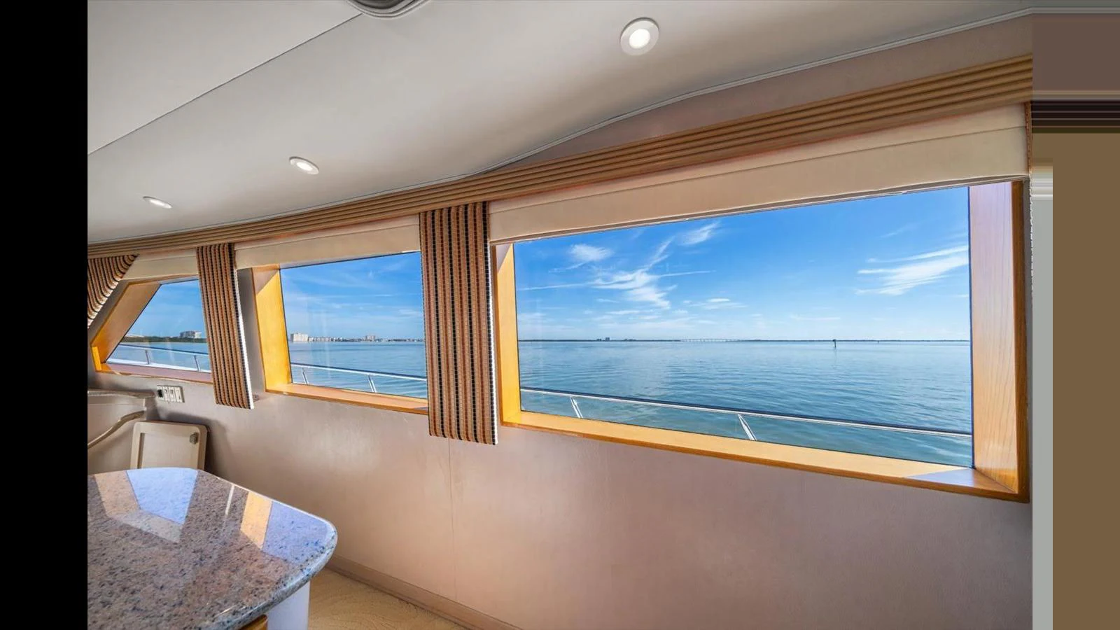 The yacht's interior offers stunning panoramic views of the sea through large windows. aboard THINK B.I.G Yacht for Sale