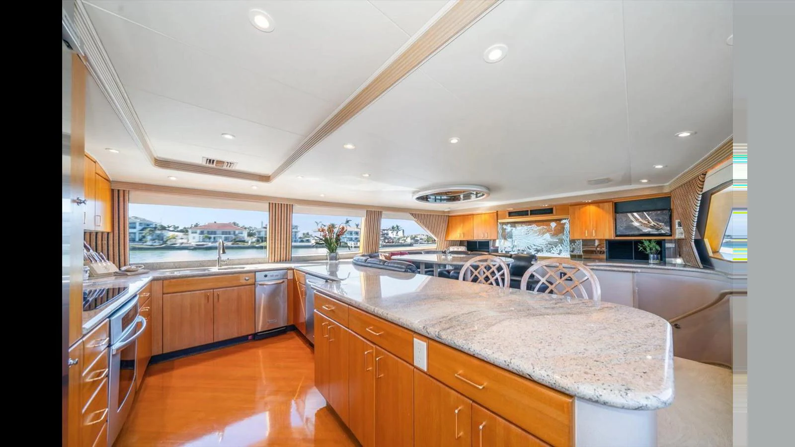 The yacht's galley features spacious countertops, modern appliances, and ample natural light. aboard THINK B.I.G Yacht for Sale