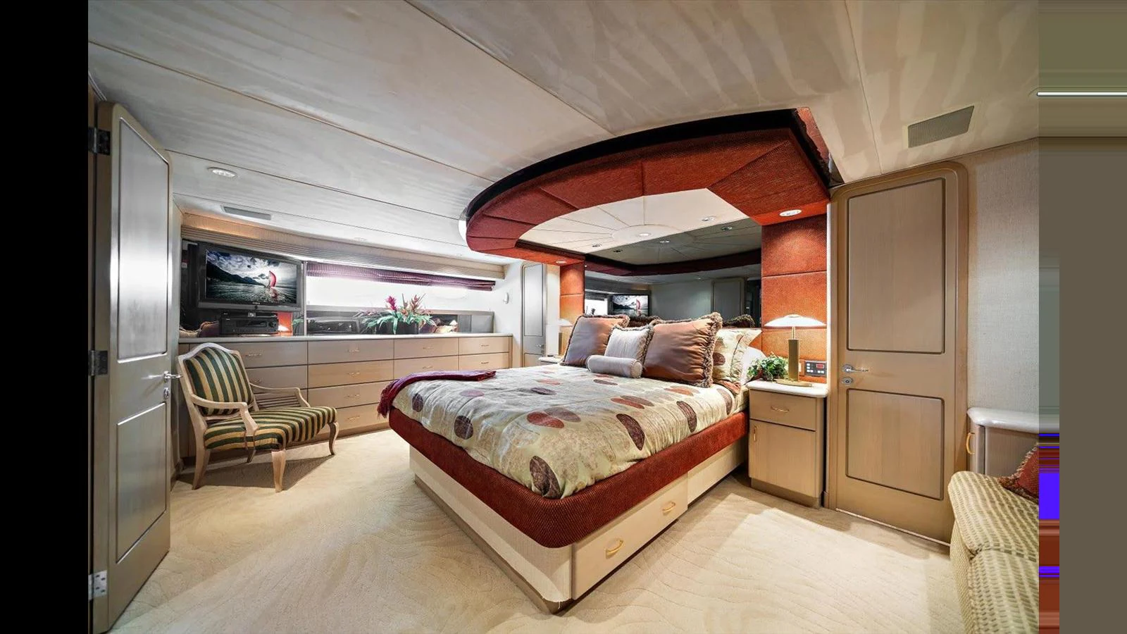 The master stateroom features a luxurious bed, elegant furnishings, and ample natural light. aboard THINK B.I.G Yacht for Sale
