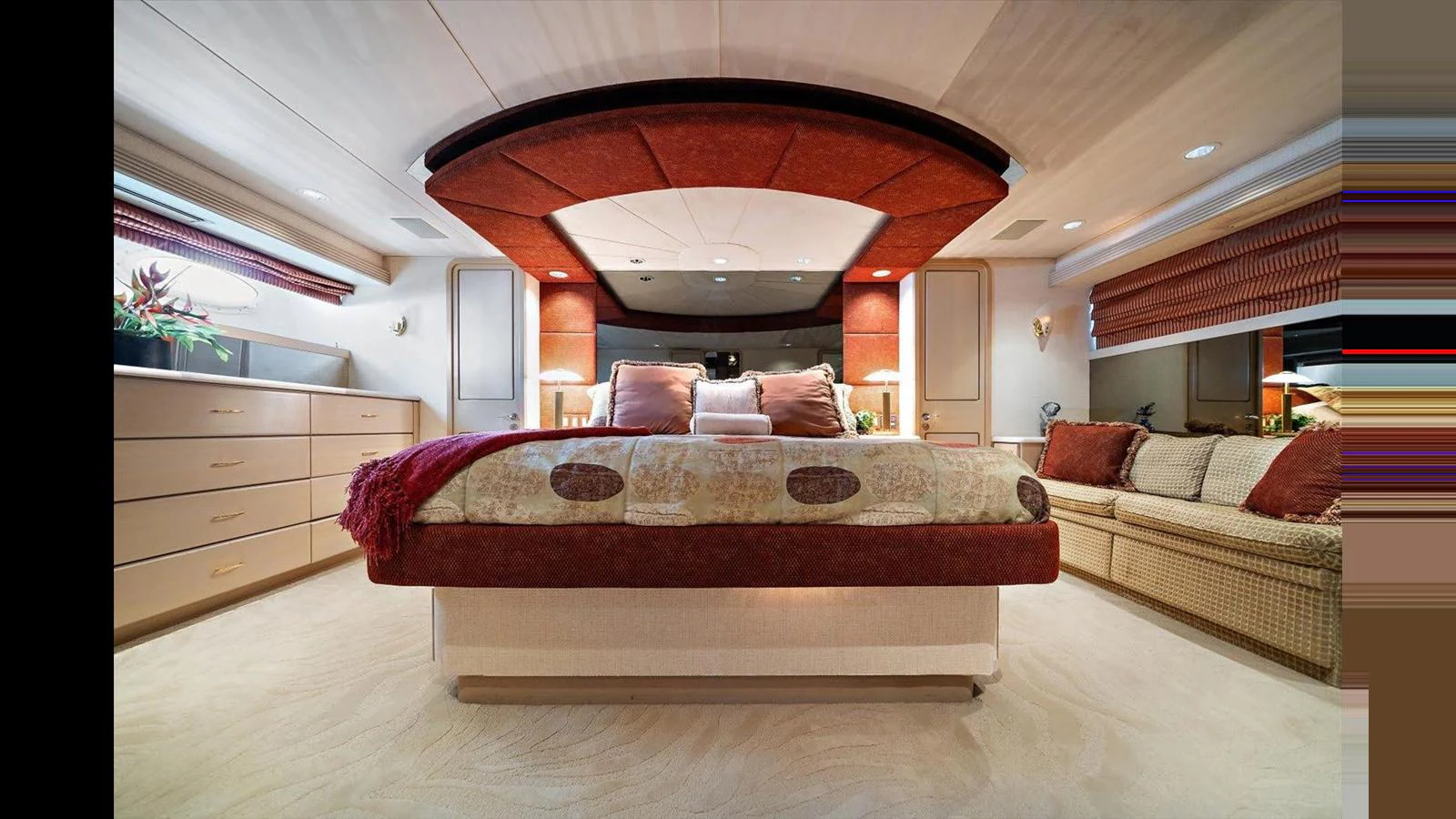 The master stateroom features a luxurious bed with elegant decor and ample storage space. aboard THINK B.I.G Yacht for Sale