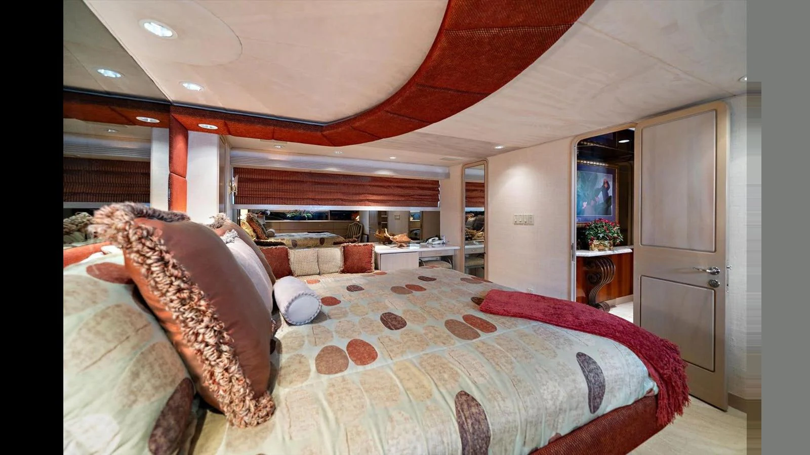 The master stateroom features a luxurious bed with plush pillows and elegant decor. aboard THINK B.I.G Yacht for Sale