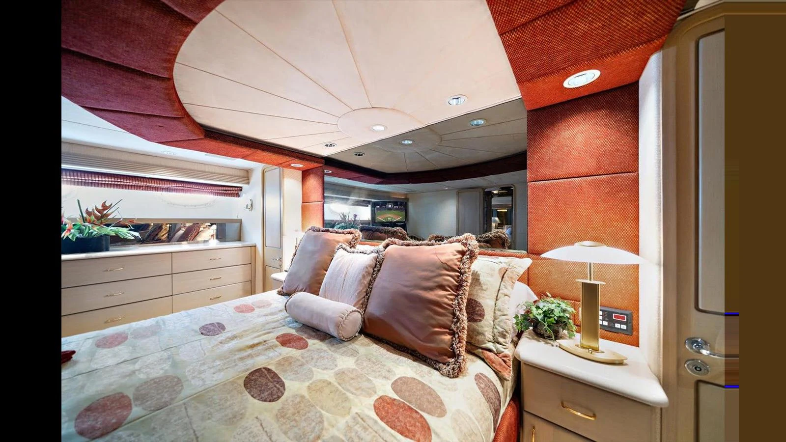 The stateroom features a luxurious bed with plush pillows and elegant decor. aboard THINK B.I.G Yacht for Sale