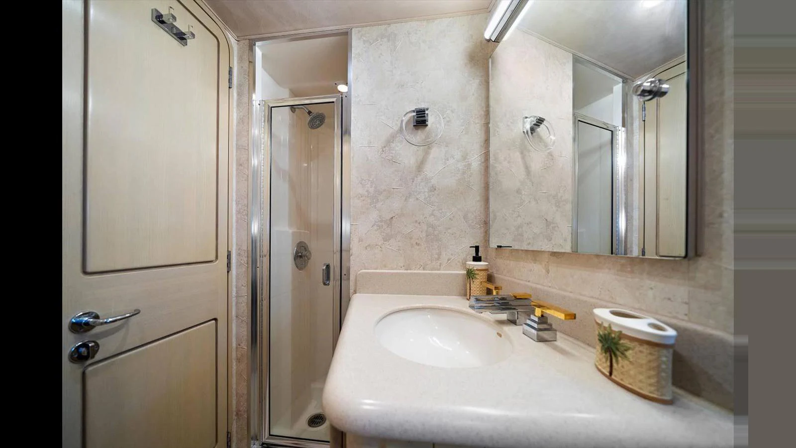 The yacht's bathroom features a sleek design with a modern shower and elegant fixtures. aboard THINK B.I.G Yacht for Sale