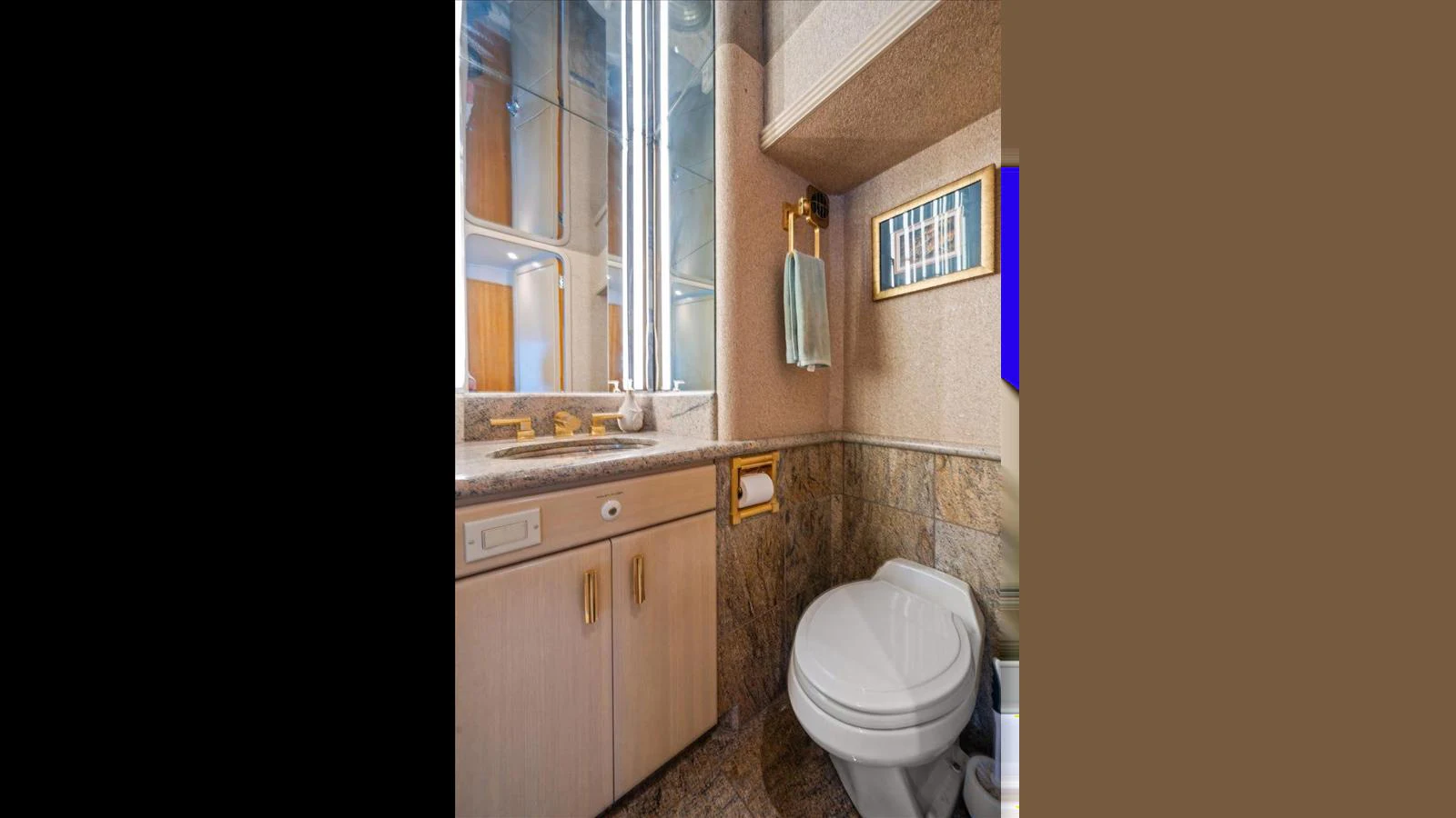 The yacht's bathroom features elegant fixtures and a well-lit vanity area. aboard THINK B.I.G Yacht for Sale