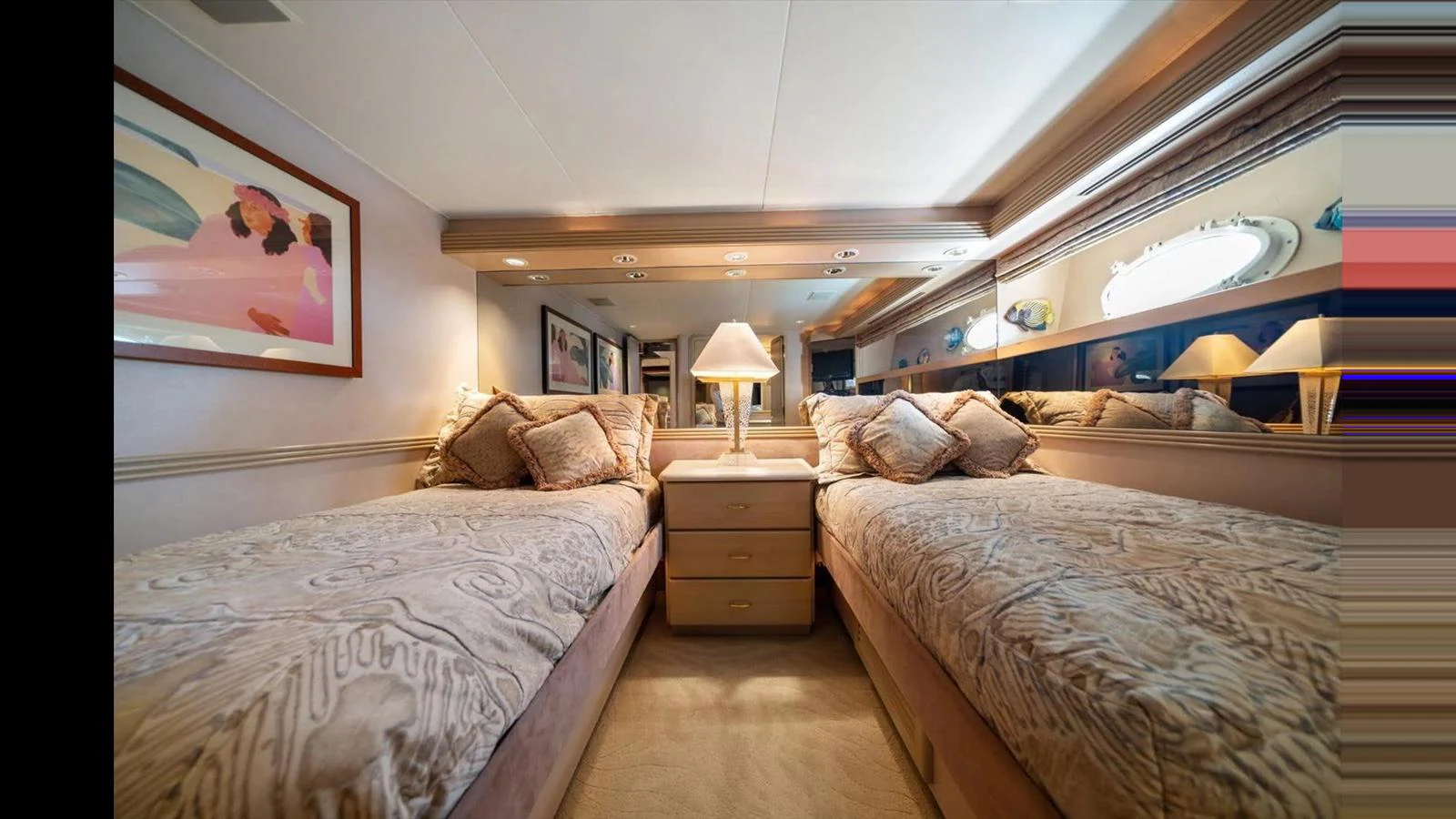 The twin stateroom offers a cozy and elegant sleeping arrangement with plush bedding and ambient lighting. aboard THINK B.I.G Yacht for Sale