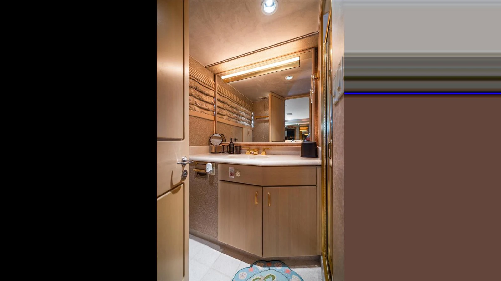 A well-appointed bathroom with modern fixtures and ample lighting. aboard THINK B.I.G Yacht for Sale