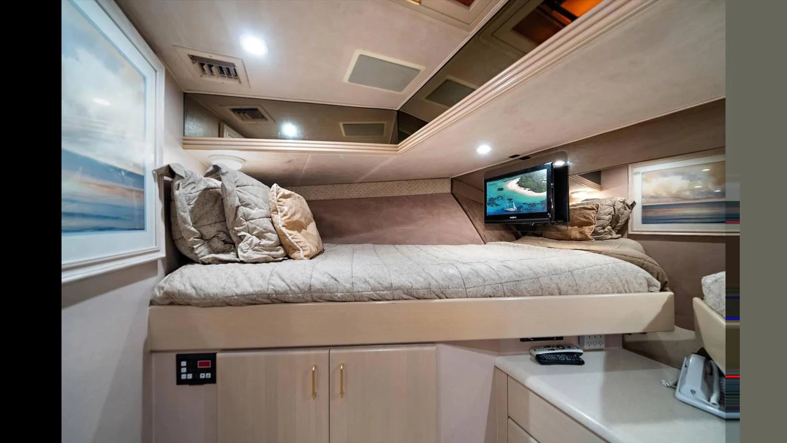 This cozy cabin features a comfortable bunk bed and modern amenities for a relaxing stay. aboard THINK B.I.G Yacht for Sale
