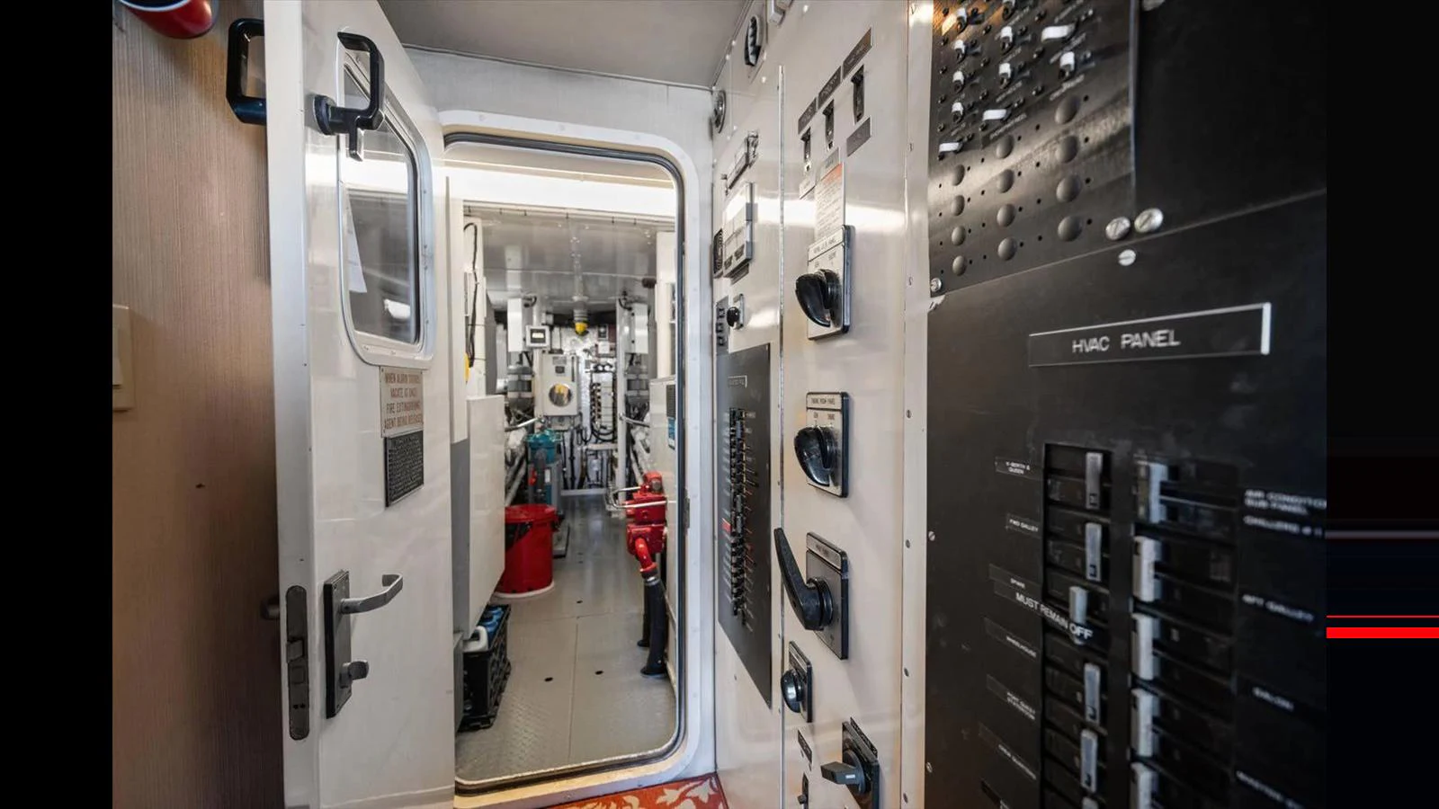 A view of the yacht's technical room showcasing various control panels and equipment. aboard THINK B.I.G Yacht for Sale