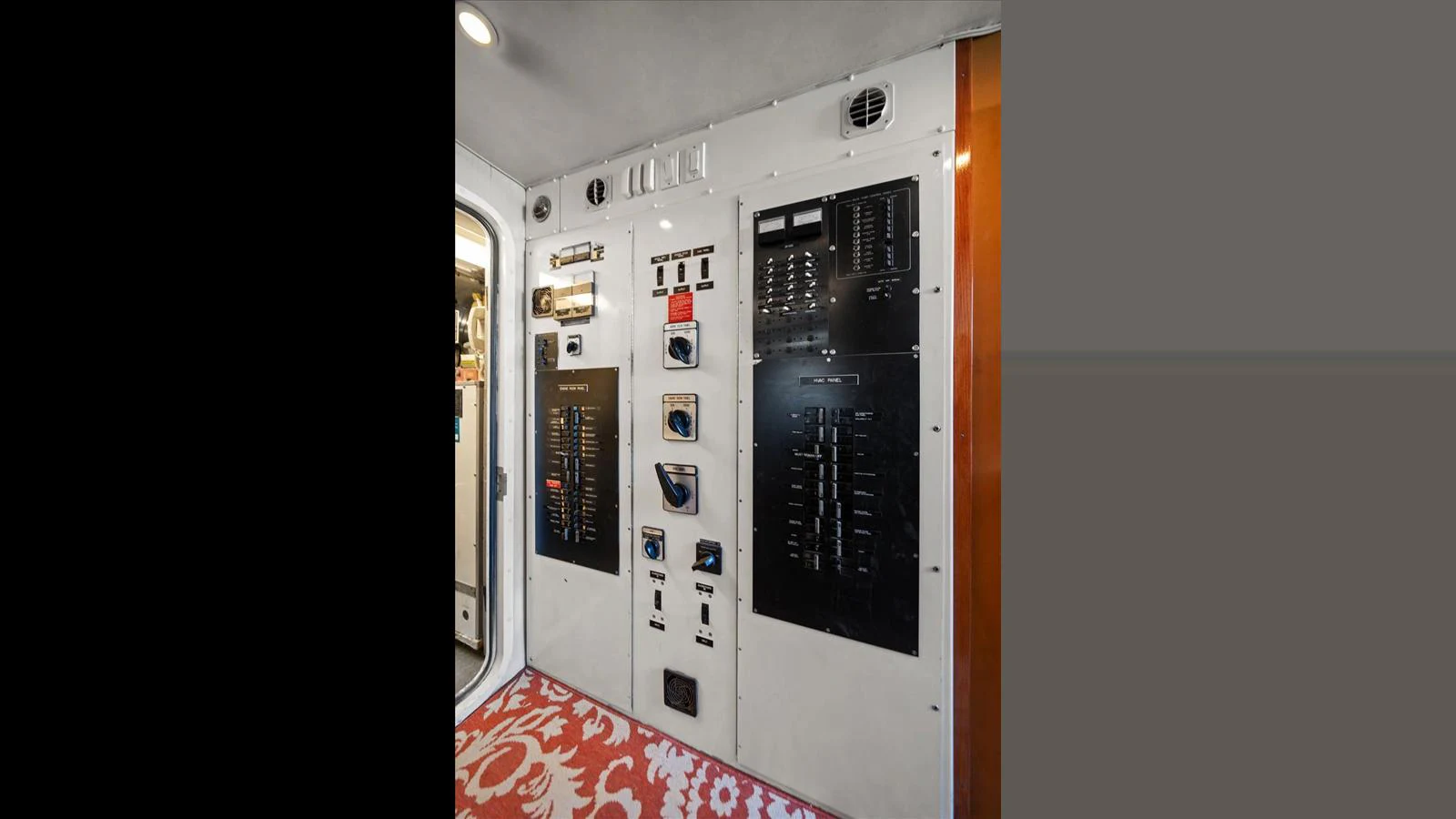 The image showcases the yacht's control panel with various switches and gauges. aboard THINK B.I.G Yacht for Sale