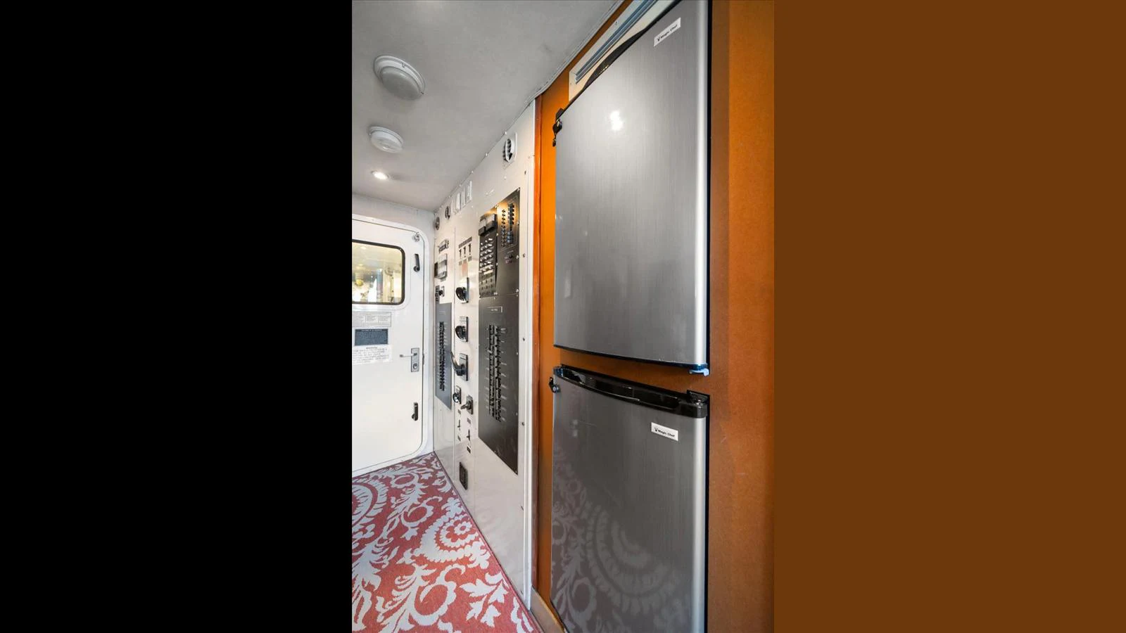The galley features modern appliances and a stylish patterned floor. aboard THINK B.I.G Yacht for Sale