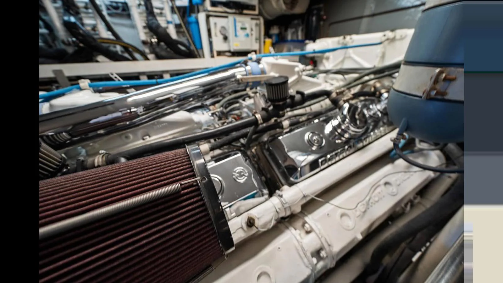 The image showcases the meticulously maintained engine room of the yacht, highlighting the powerful machinery. aboard THINK B.I.G Yacht for Sale