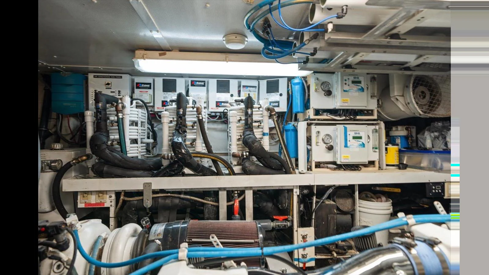 The image showcases the yacht's well-organized engine room with various mechanical and electrical components. aboard THINK B.I.G Yacht for Sale