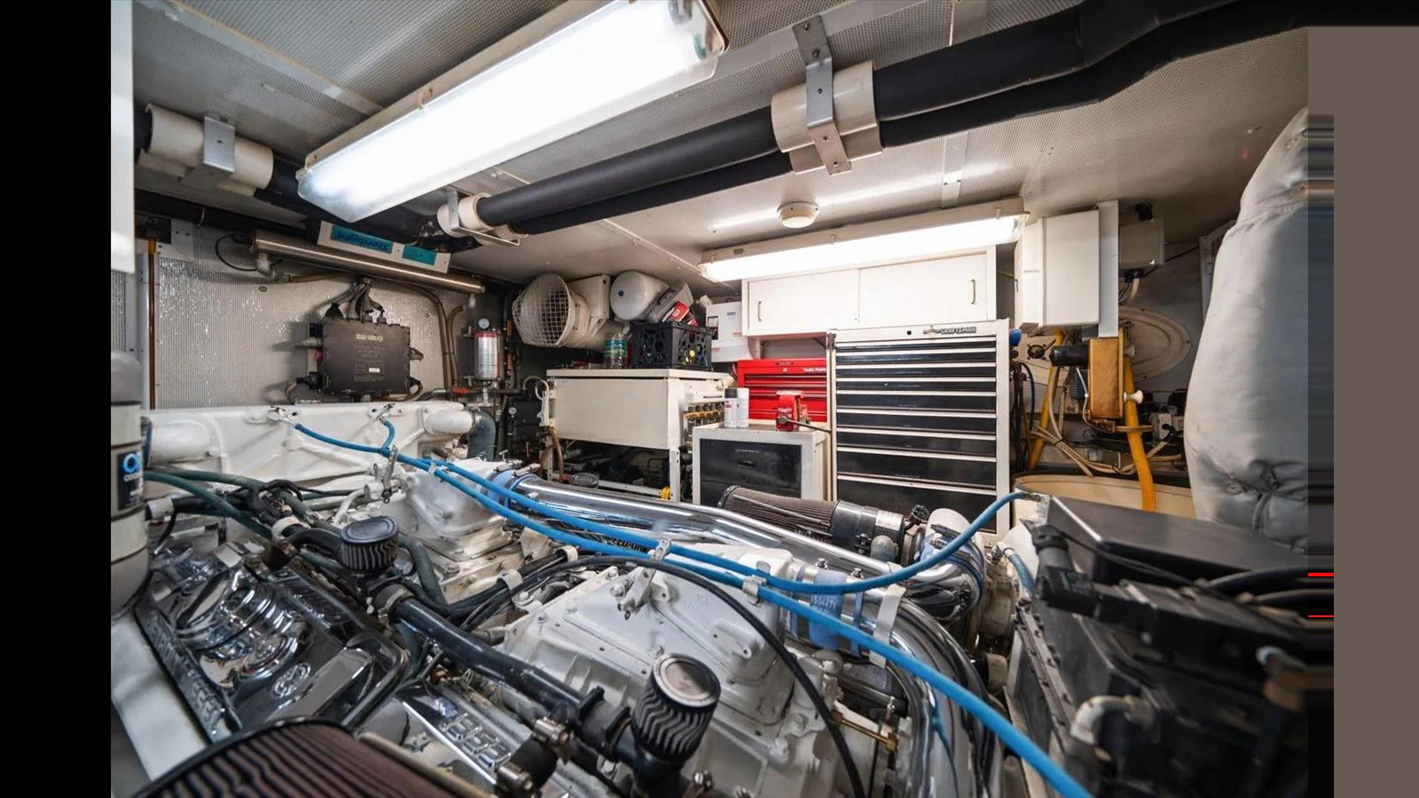 The image showcases the well-maintained engine room of the yacht, highlighting its mechanical components and organization. aboard THINK B.I.G Yacht for Sale