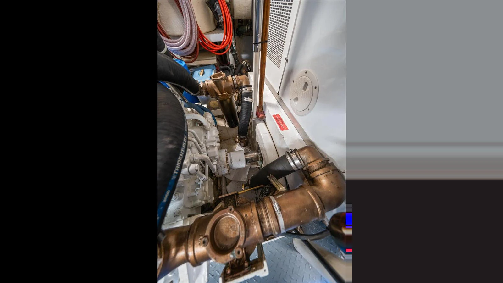The image showcases the intricate mechanical components within the yacht's engine room. aboard THINK B.I.G Yacht for Sale