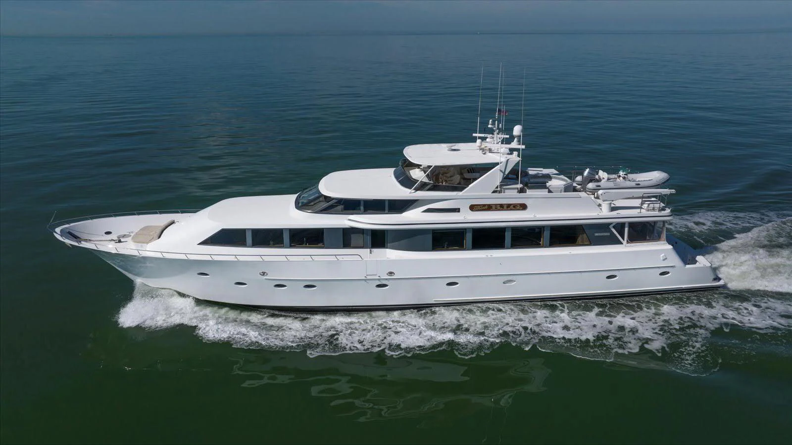 A sleek and elegant yacht cruising smoothly on calm waters. aboard THINK B.I.G Yacht for Sale