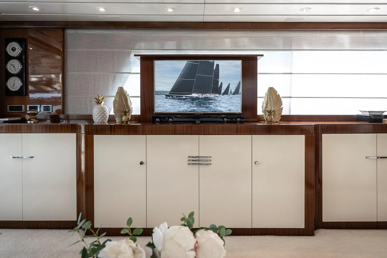 a kitchen with white cabinets aboard AXEBT Yacht for Sale