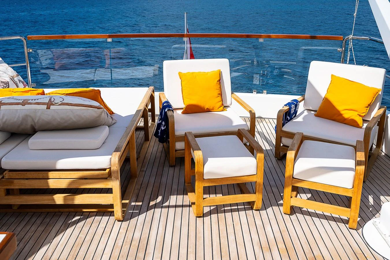 a boat with chairs on the deck aboard AXEBT Yacht for Sale