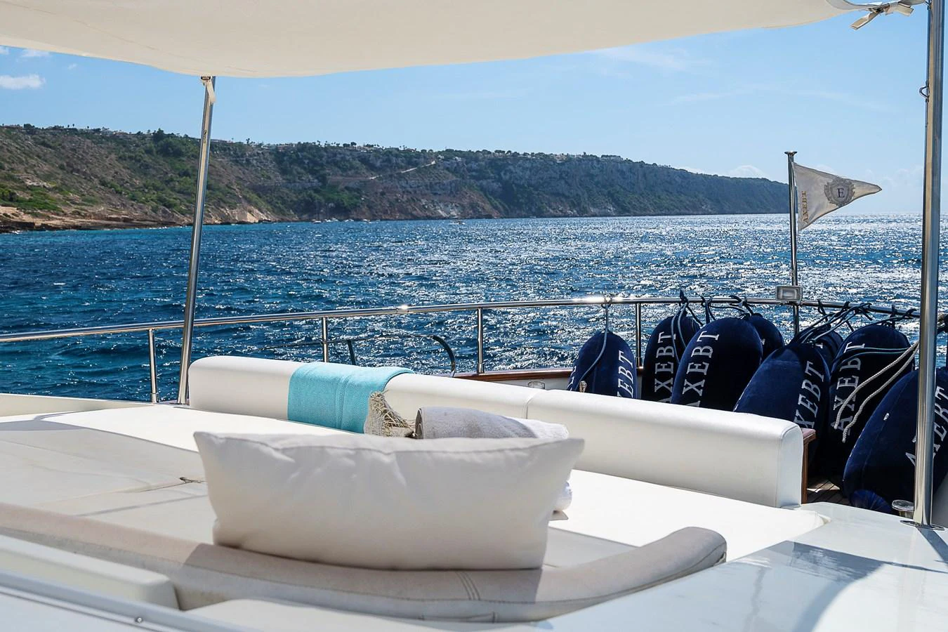 a boat with a white pillow on it in the water aboard AXEBT Yacht for Sale