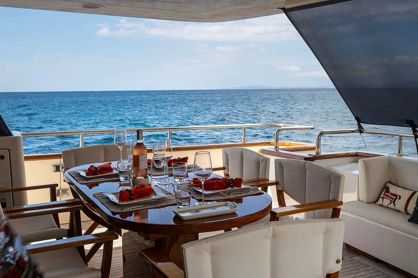 a table set for a meal on a boat aboard AXEBT Yacht for Sale
