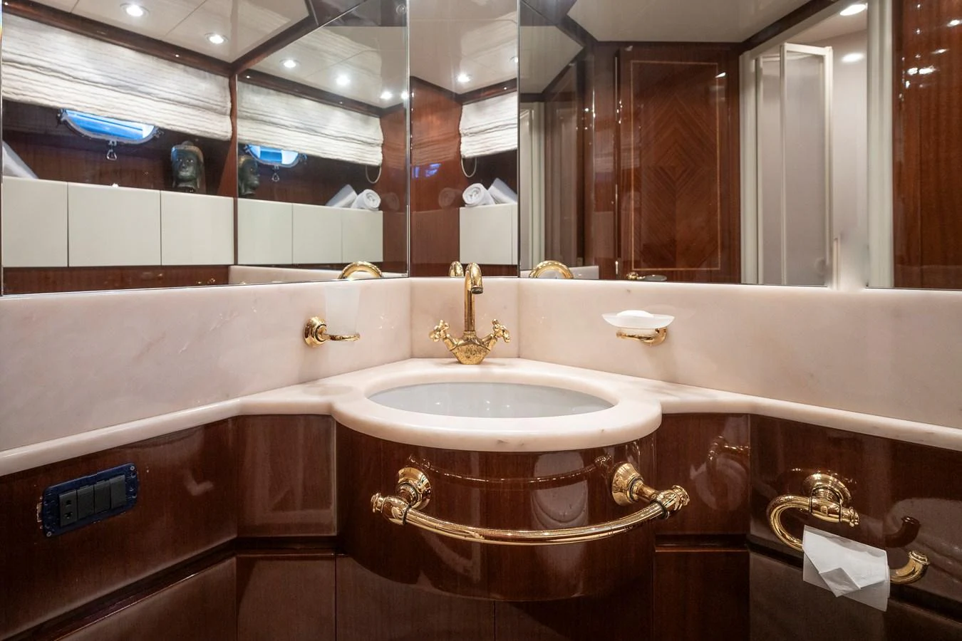 a bathroom with a tub sink and a sink aboard AXEBT Yacht for Sale